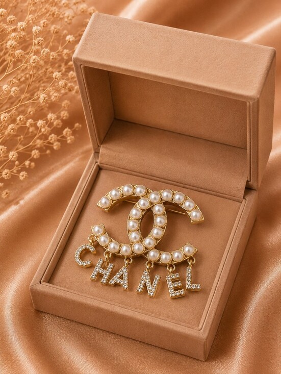 The Unbranded Brand Jewelry - CHANEL Gold-Tone Pearl CC Logo Brooch with Crystal Letter Drops